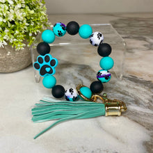 Load image into Gallery viewer, Silicone Bracelet Keychain - Paw Print Teal Swirl
