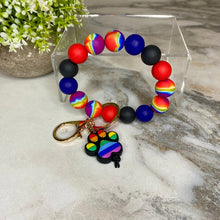 Load image into Gallery viewer, Silicone Bracelet Keychain - Dog Paw Rainbow
