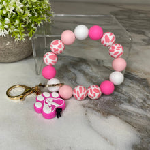 Load image into Gallery viewer, Silicone Bracelet Keychain - Pink &amp; White Dog Paw
