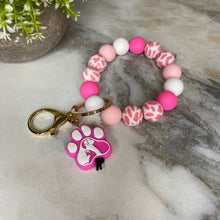 Load image into Gallery viewer, Silicone Bracelet Keychain - Pink &amp; White Dog Paw
